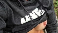 Outdoor solo masturbation scene with curly blonde